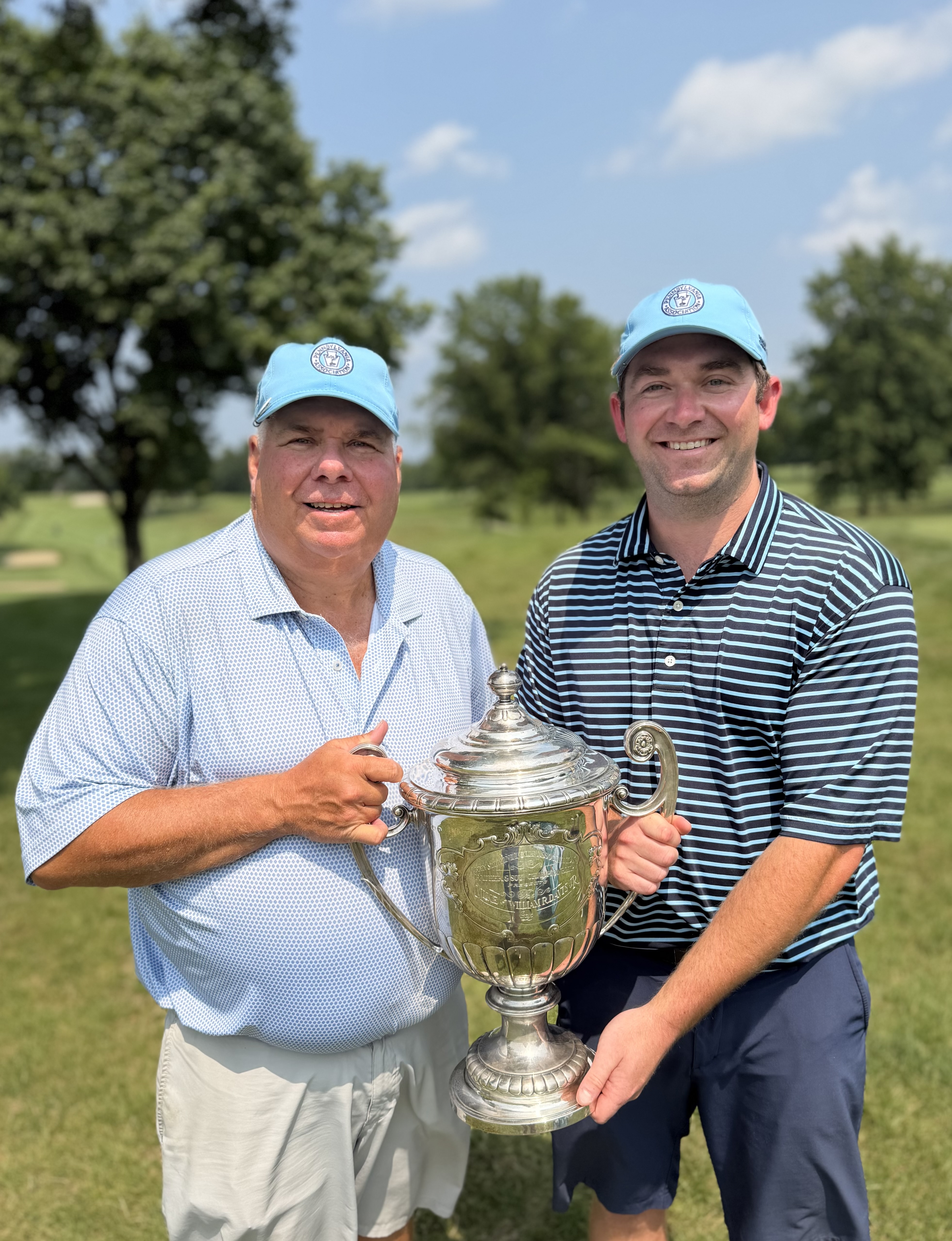 The Cutrells with the Father-Son trophy