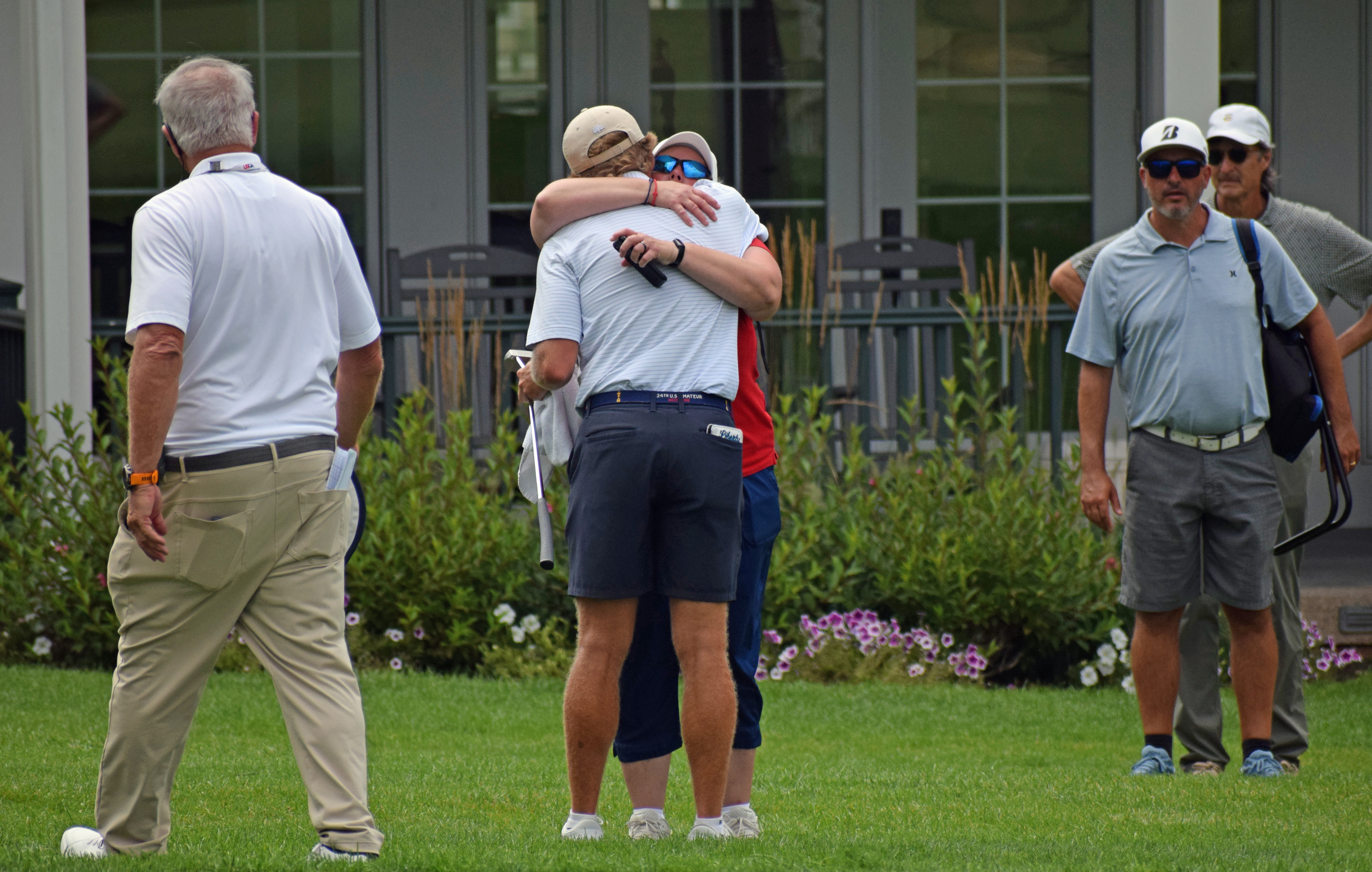 Josh Ryan embraces his mother after winning the 113th Amateur Championship at Oakmont Country Club